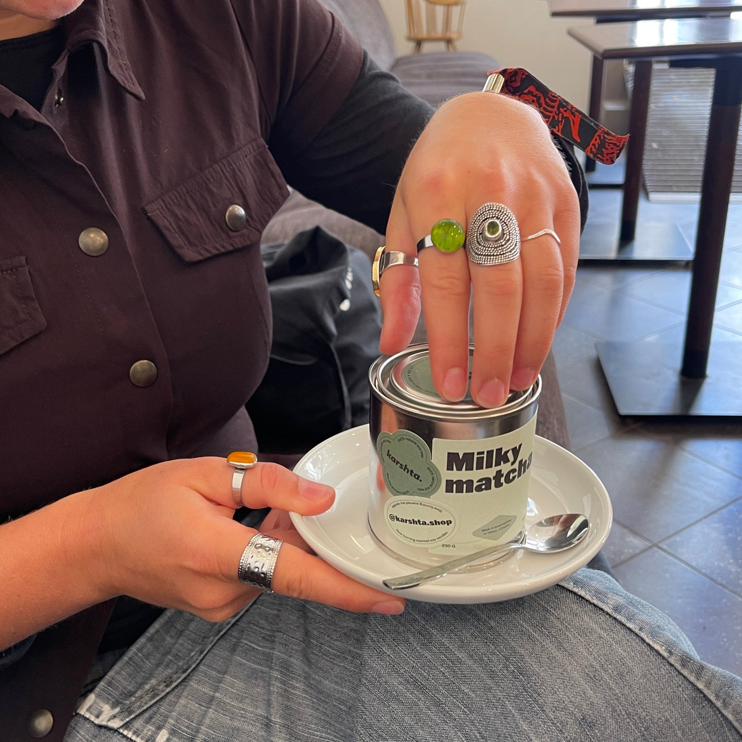 Person holding a can